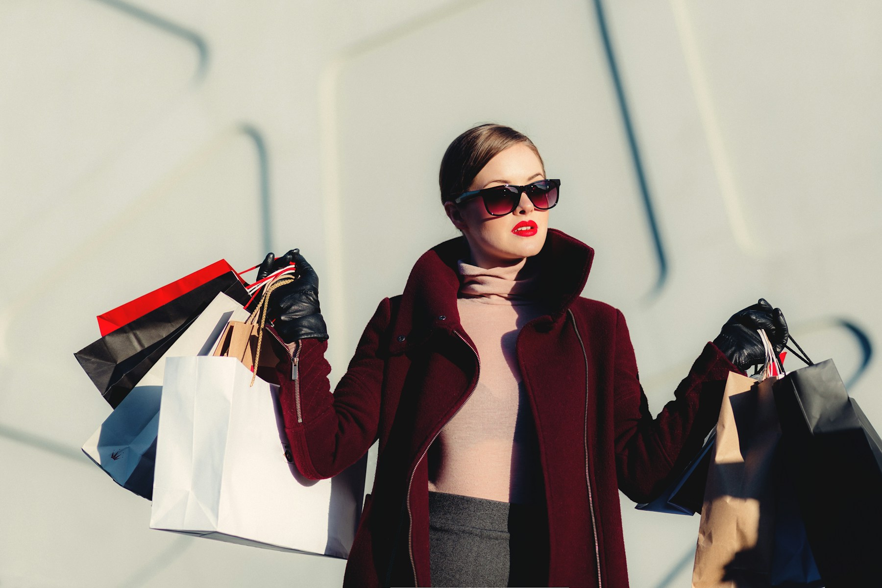 Illustrative fashion shopper carrying shopping bags